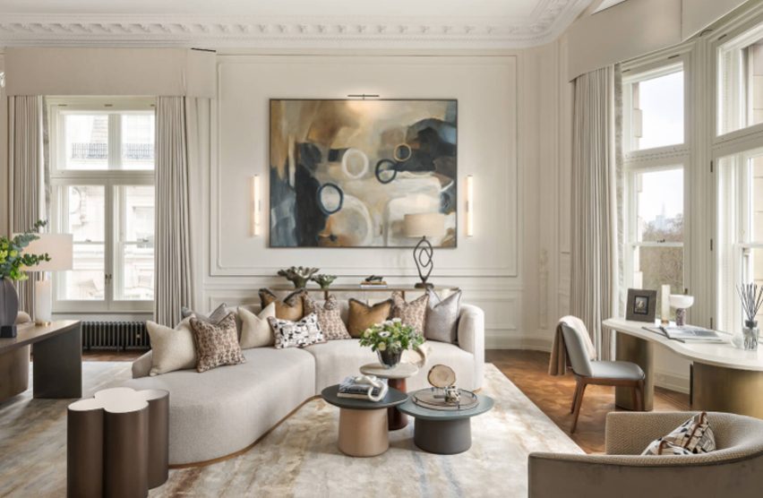 Large-scale contemporary artwork displayed above a luxury seating area, demonstrating how statement art creates a focal point in high-end interior design.
