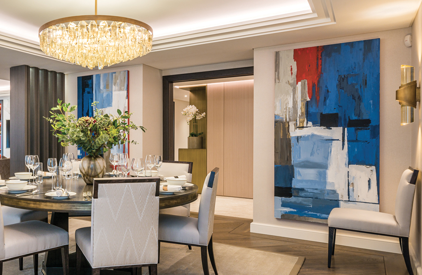 Contemporary large-scale bespoke artwork displayed in a luxury show home dining area, helping create an emotional connection with prospective buyers.